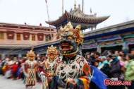 Monks perform Cham dance to pray for good harvest, peaceful life in Qinghai