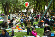 People enjoy leisure time at Norbulingka in Lhasa, China's Xizang