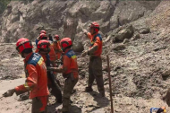 Rescuers carry out search and rescue operations at mudslide-hit area in China's Xizang