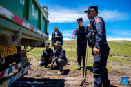 Police officers stand guard at China's highest-altitude border police station
