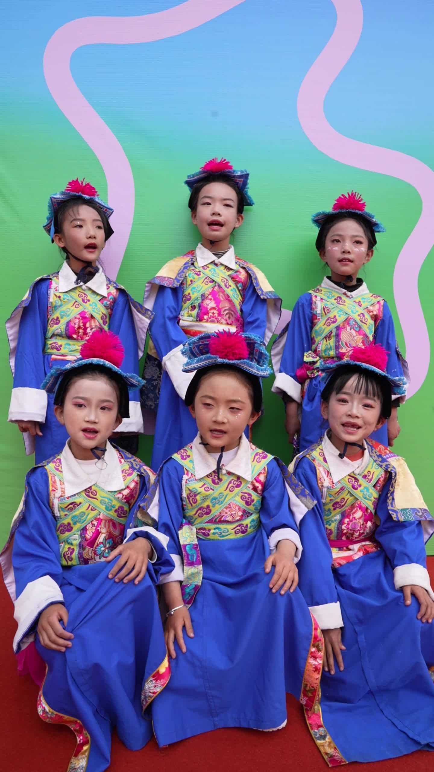 Students from Gyalthang County, Shangri-La, sing cheerful songs