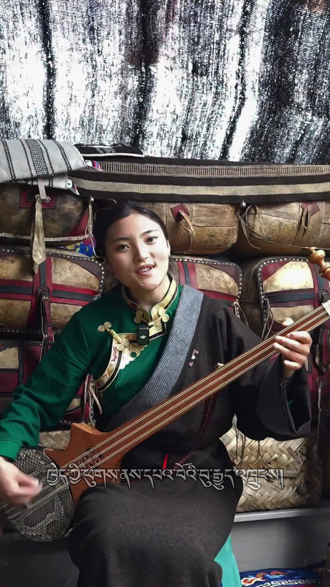 Dardron sings Tibetan songs in the black tent in Jigzhi County, Golog, Qinghai