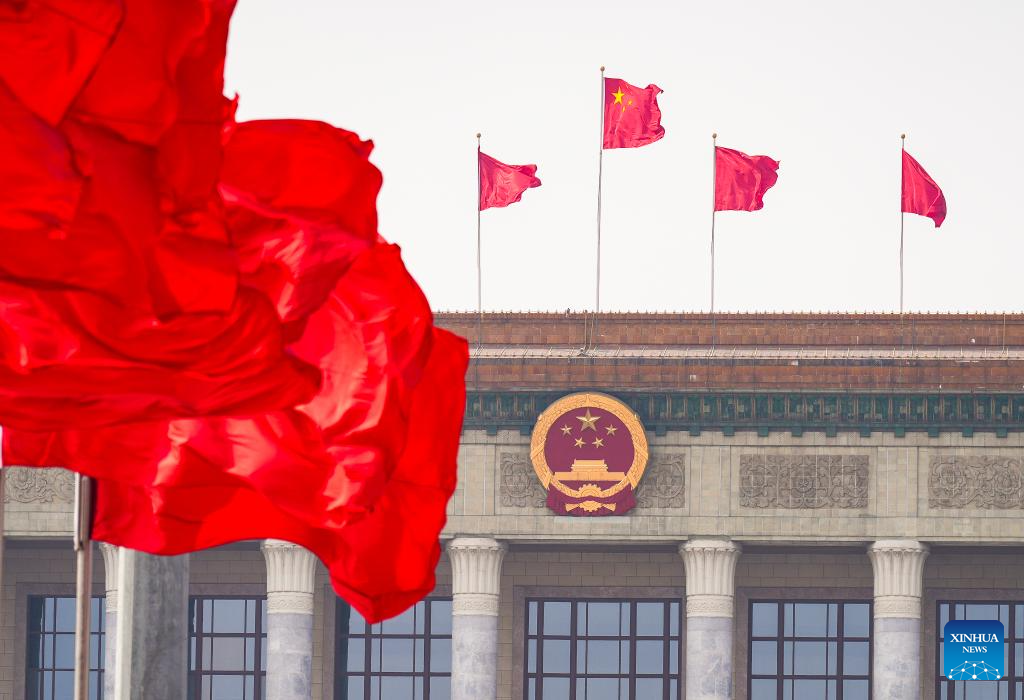 China's national legislature holds closing meeting of annual session