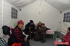 People evacuated to tents in quake-hit county