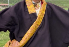 Clip of a handsome Tibetan man dancing with sweet smiles