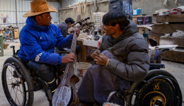 Disabled man turns page with stationery company