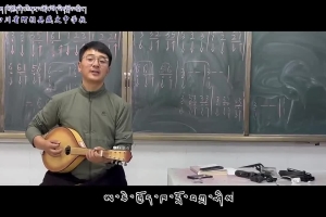 Tibetan students have music class, learning to sing while playing the musical instrument