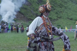 Models walk on the grassland during the yak games in Chaggo County, Sichuan's Garze